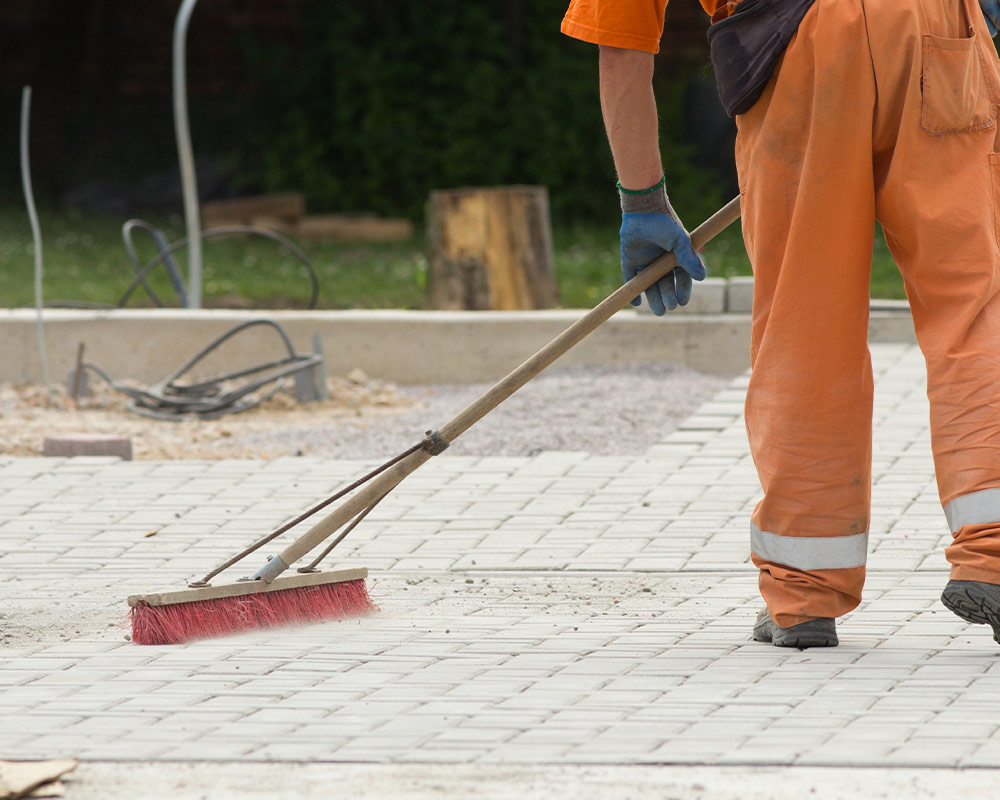 worker performing construction clean up lafayette la